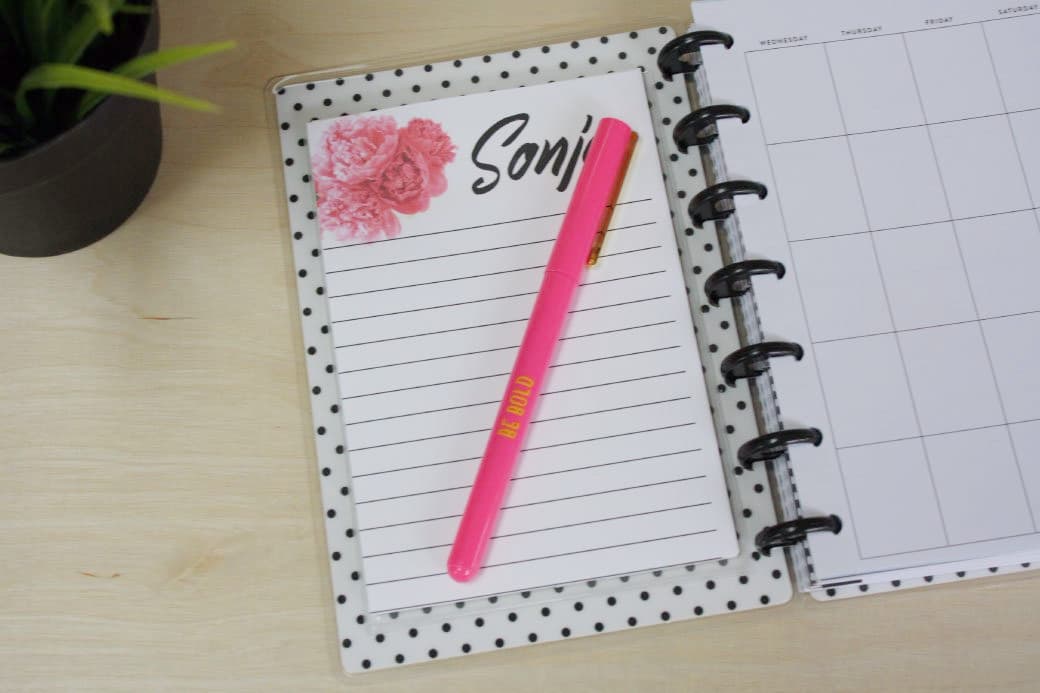 planner with personalized notepad in clear adhesive pocket applied to planner inside cover