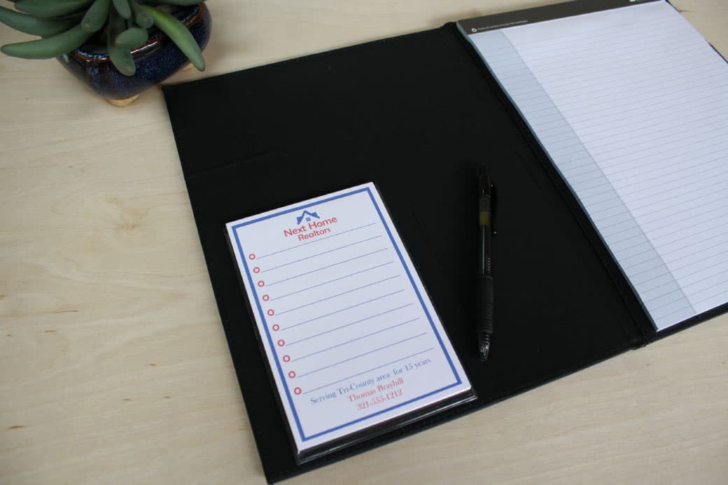 business notepad in clear adhesive pocket to inside padfolio